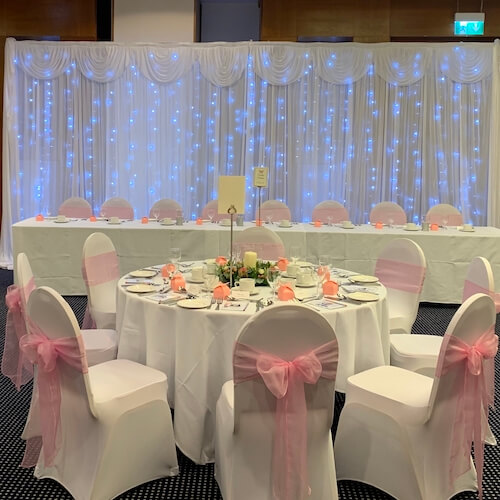 Our beautiful starlight backdrop with swags is the perfect addition to any event. We also have a matching starlight top table skirting and cake table skirting. The starlight dancefloor is available in three different sizes, 12x12, 14x14 and 16x16.