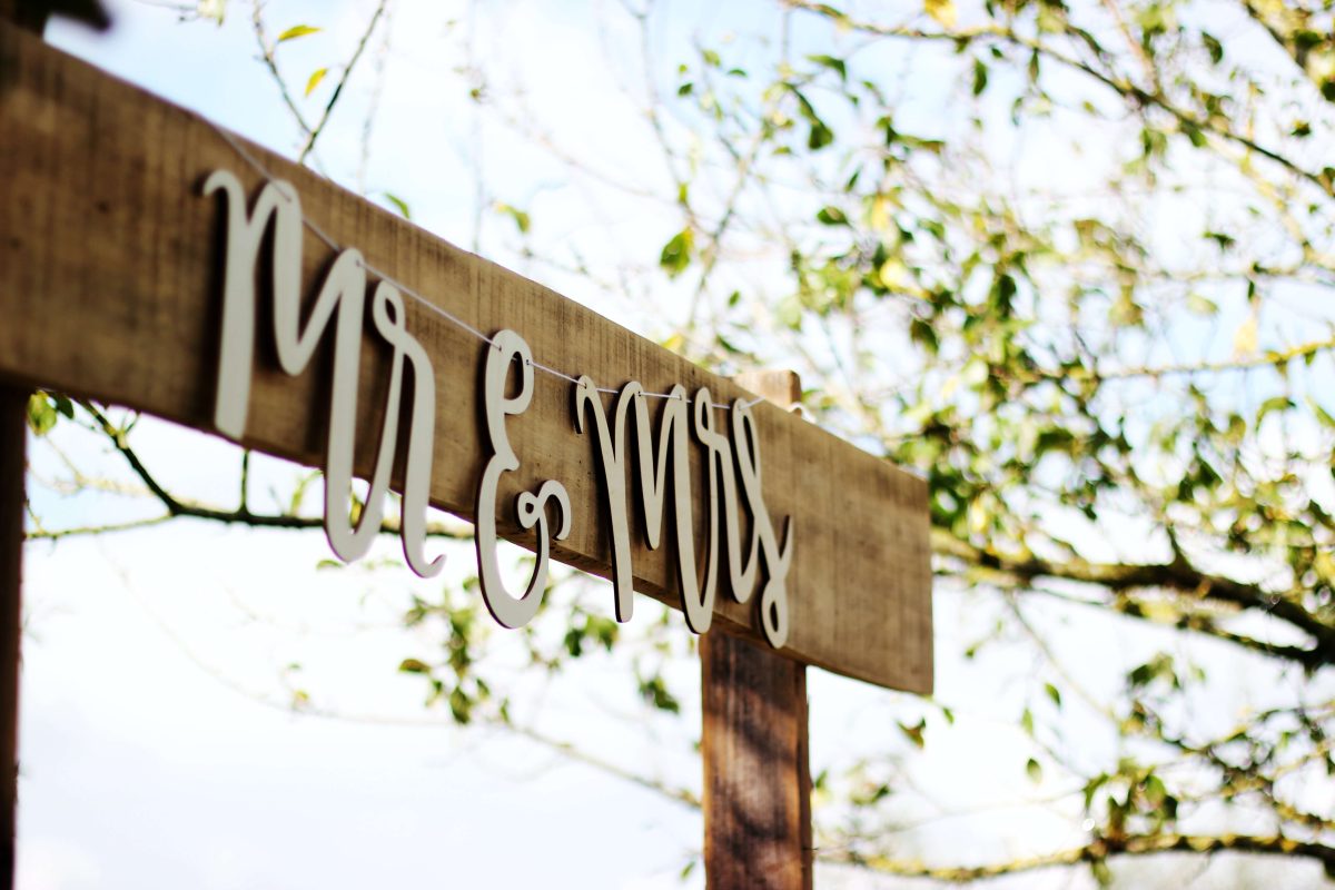 Mr and Mrs sign on wooden structure in outdoor setting