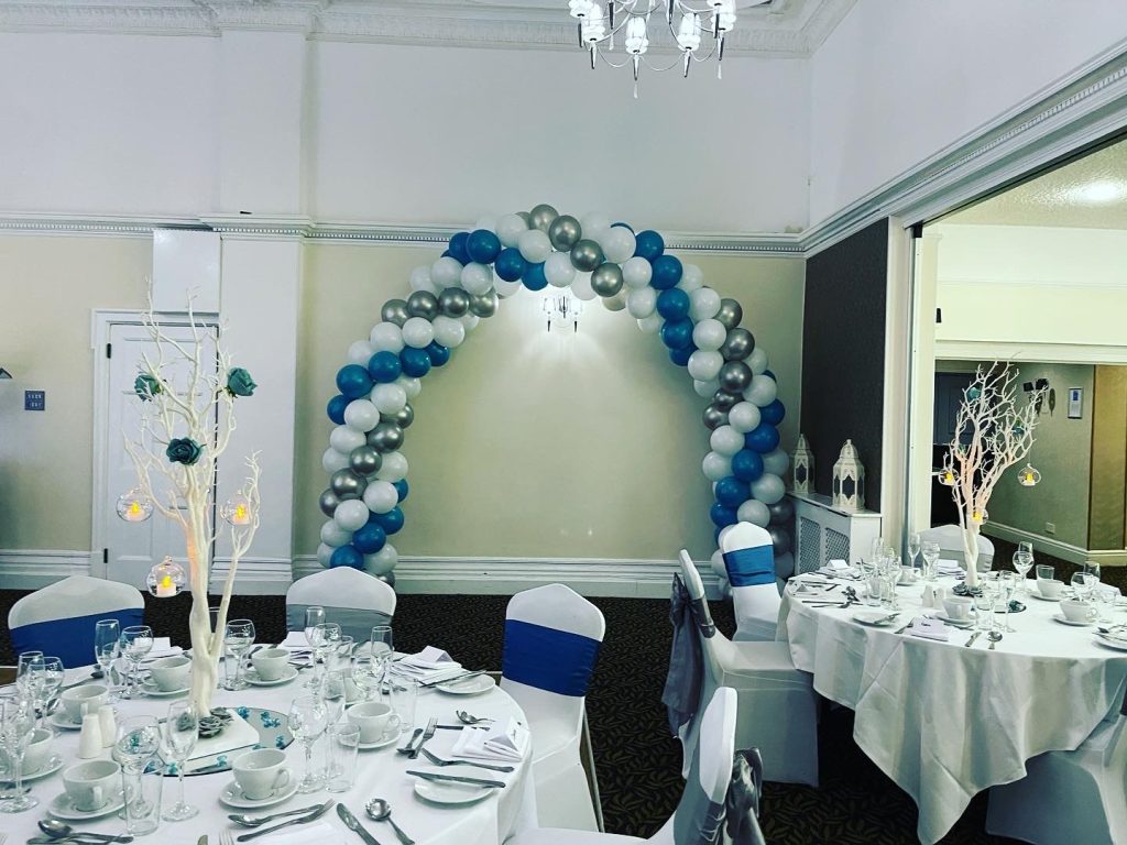 winter wedding themed venue room decorated with silver, ice an white colours