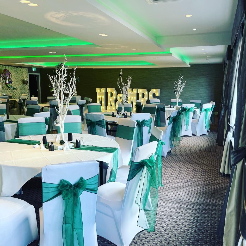 green colour theme wedding decorations and light up letters spelling mrs & mrs